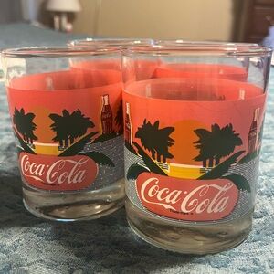 Set of 4 Vintage Coca Cola tumblers. Pink with palm trees. Excellent condition.